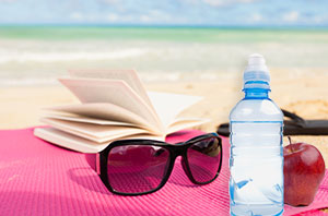 Book and Water on the Beach