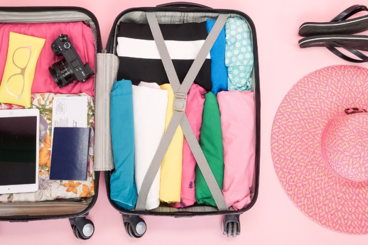 suitcase full of beach vacation essentials