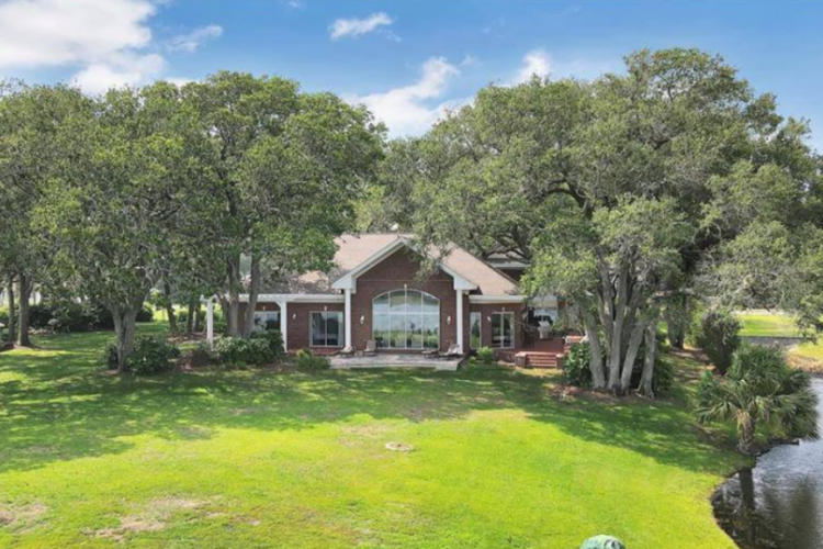 exterior view of a vacation rental home by the water