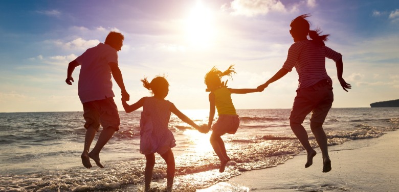 family playing on the beach | Sunset Beach