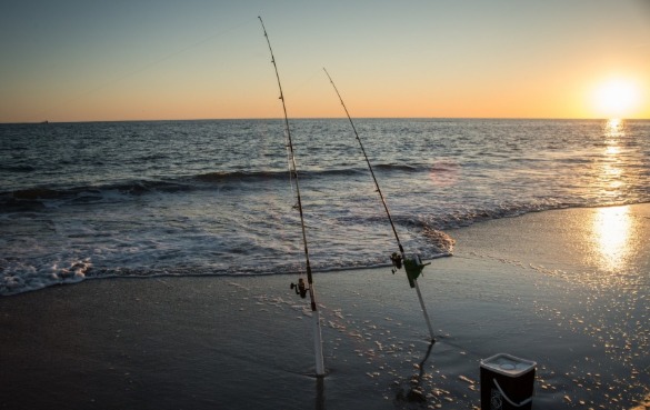 surf fishing gear on the beach | Sunset Vacations
