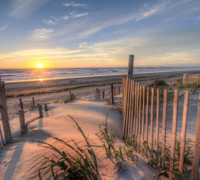 early morning sunrise over the beach | Sunset Vacations