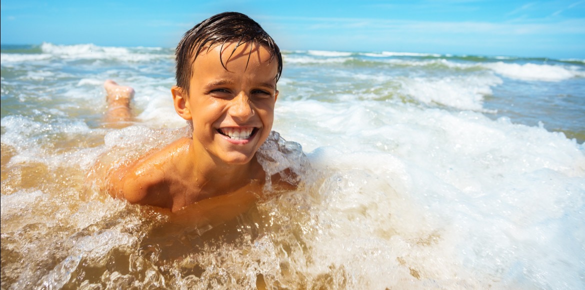 Kid in the Ocean | Sunset Vacations