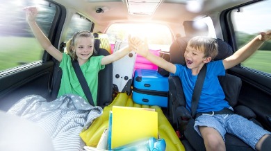 kids riding in car on the way to vacation | Sunset Vacations