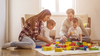 family playing with blocks together | Sunset Vacations