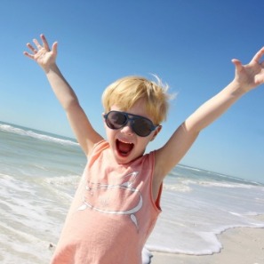 happy little boy on the beach | Sunset Vacations