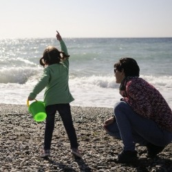 mother and daughter on sunset beach | Sunset Vacations